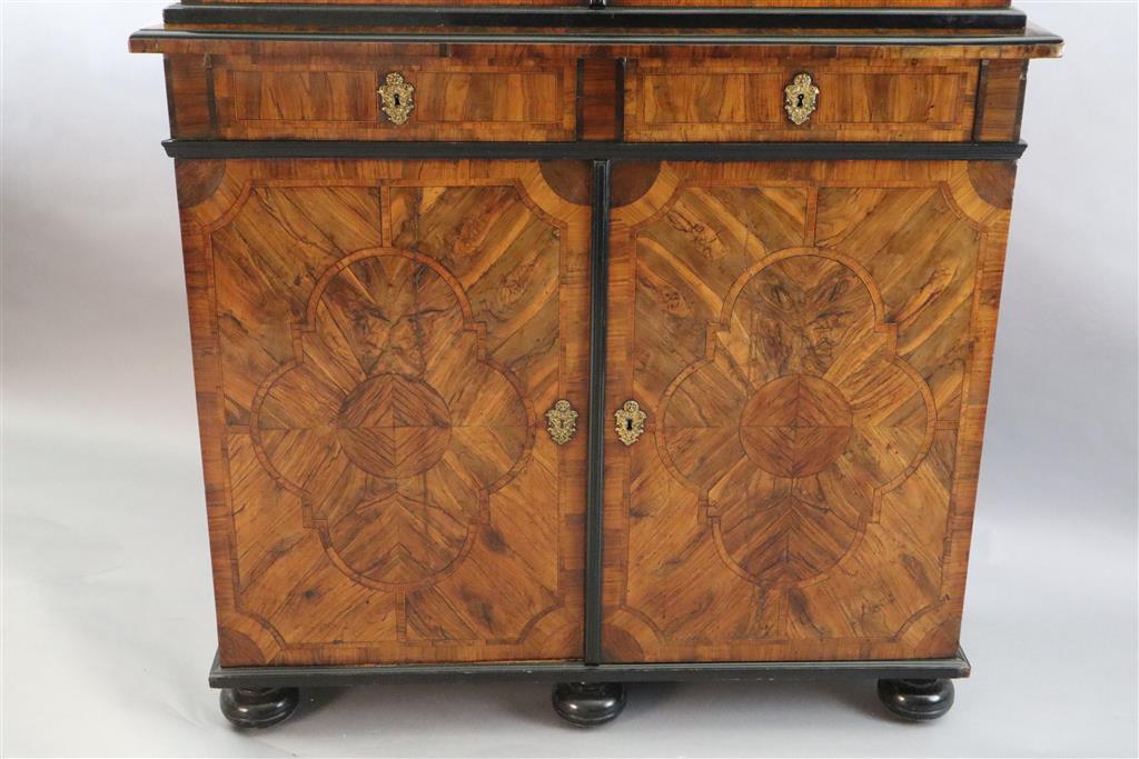 An 18th century Dutch walnut, olivewood and ebony bookcase, W.4ft 2in. D.1ft 5.5in. H.7ft